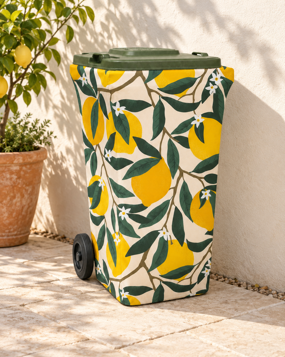 Lemon Squeeze wheelie bin cover beside a lemon tree in a sunlit courtyard