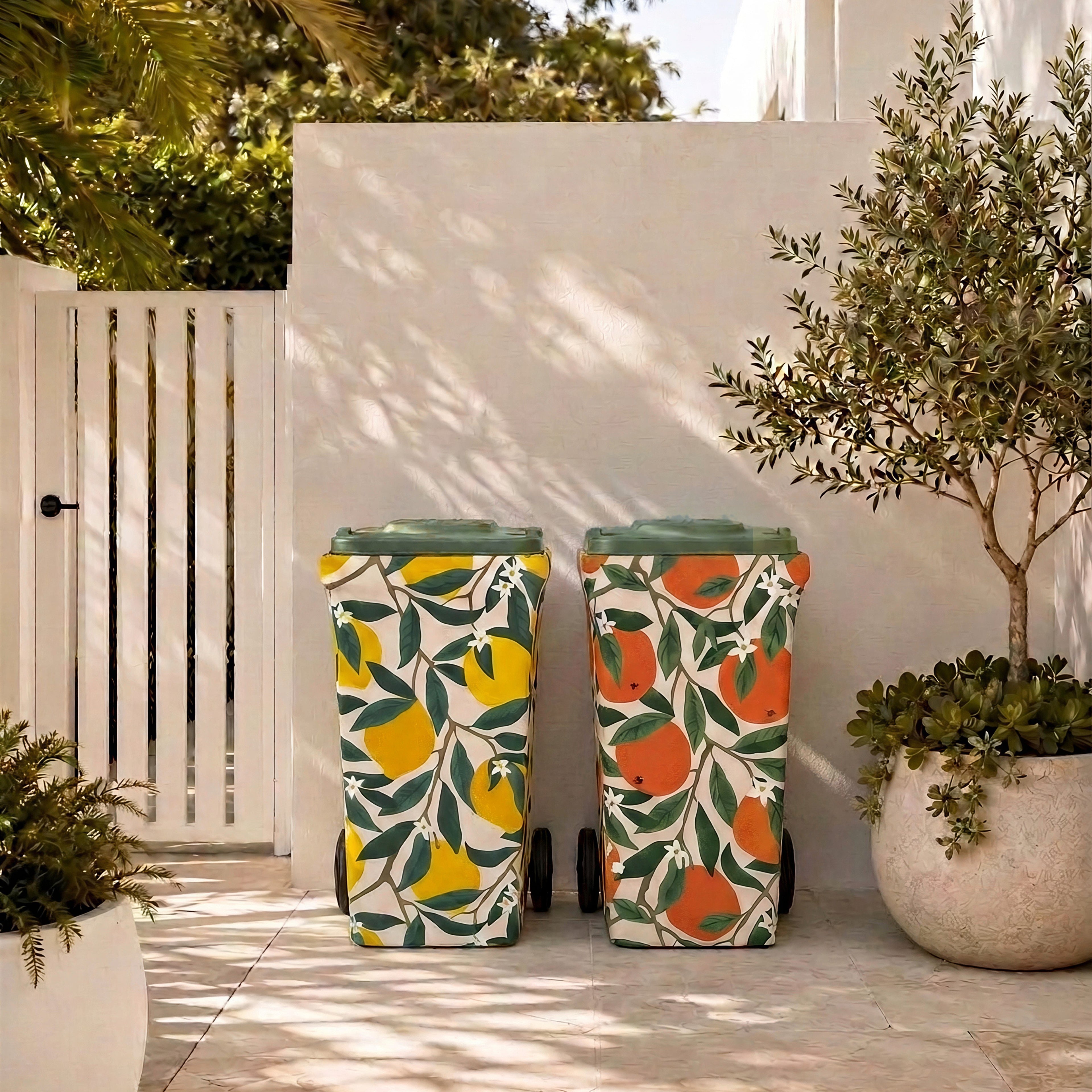 Lemon Squeeze and Valencia wheelie bin covers side by side in a modern Australian courtyard