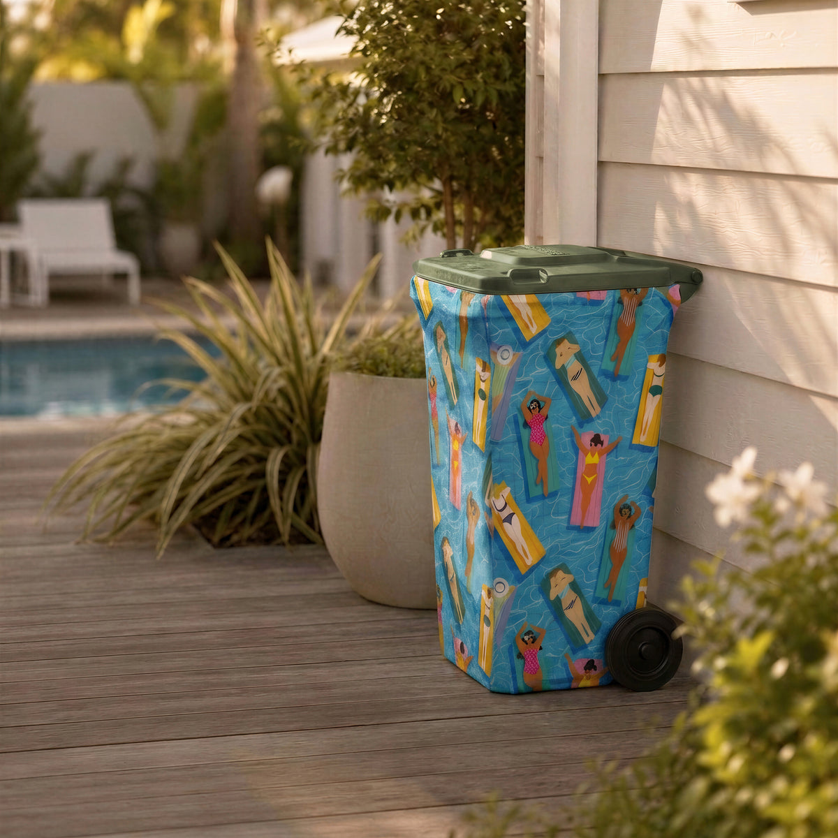 Pool Party wheelie bin cover on a bin beside a backyard pool